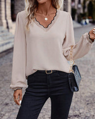 Ruffled V-neck solid color blouse